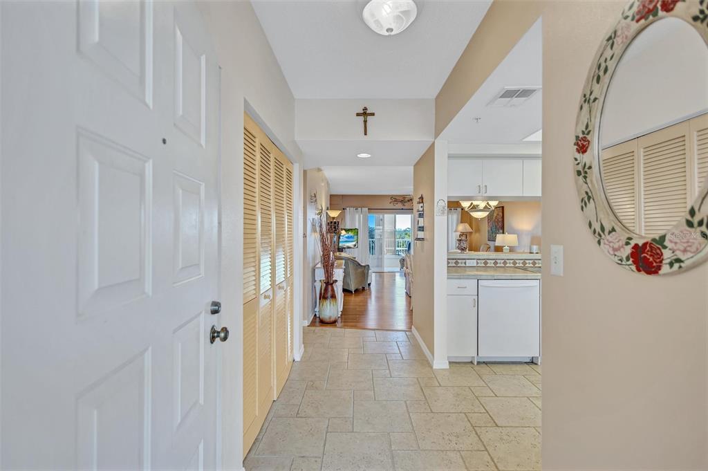 6475 Shoreline Drive, Unit 5102 St. Petersburg, FL 33708 - Photo 5 of 39 a view of a hallway to closet and a window
