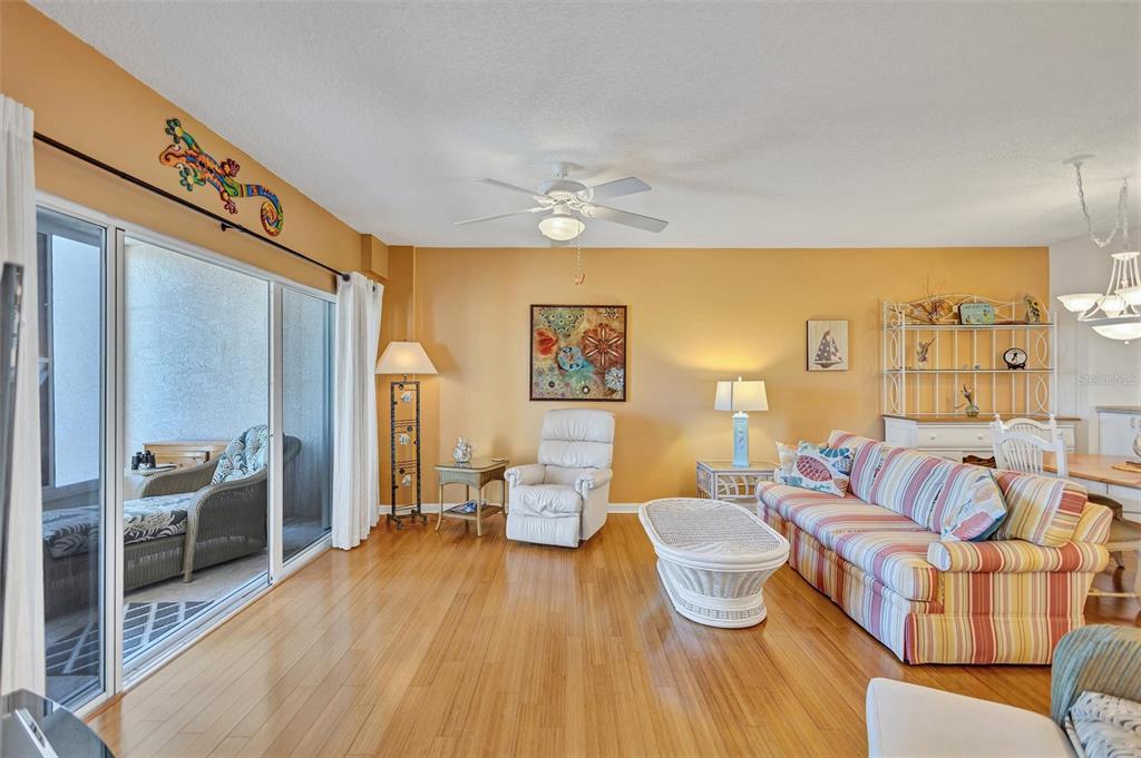 6475 Shoreline Drive, Unit 5102 St. Petersburg, FL 33708 - Photo 7 of 39 a living room with furniture and a chandelier