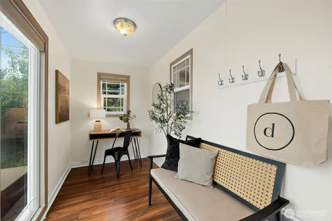 a view of a livingroom with furniture and wooden floor