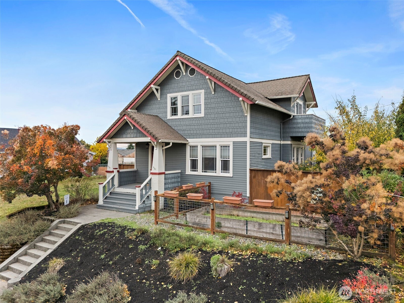 5207 North Pearl Street Ruston, WA 98407 - Photo 2 of 39 a front view of a house with garden