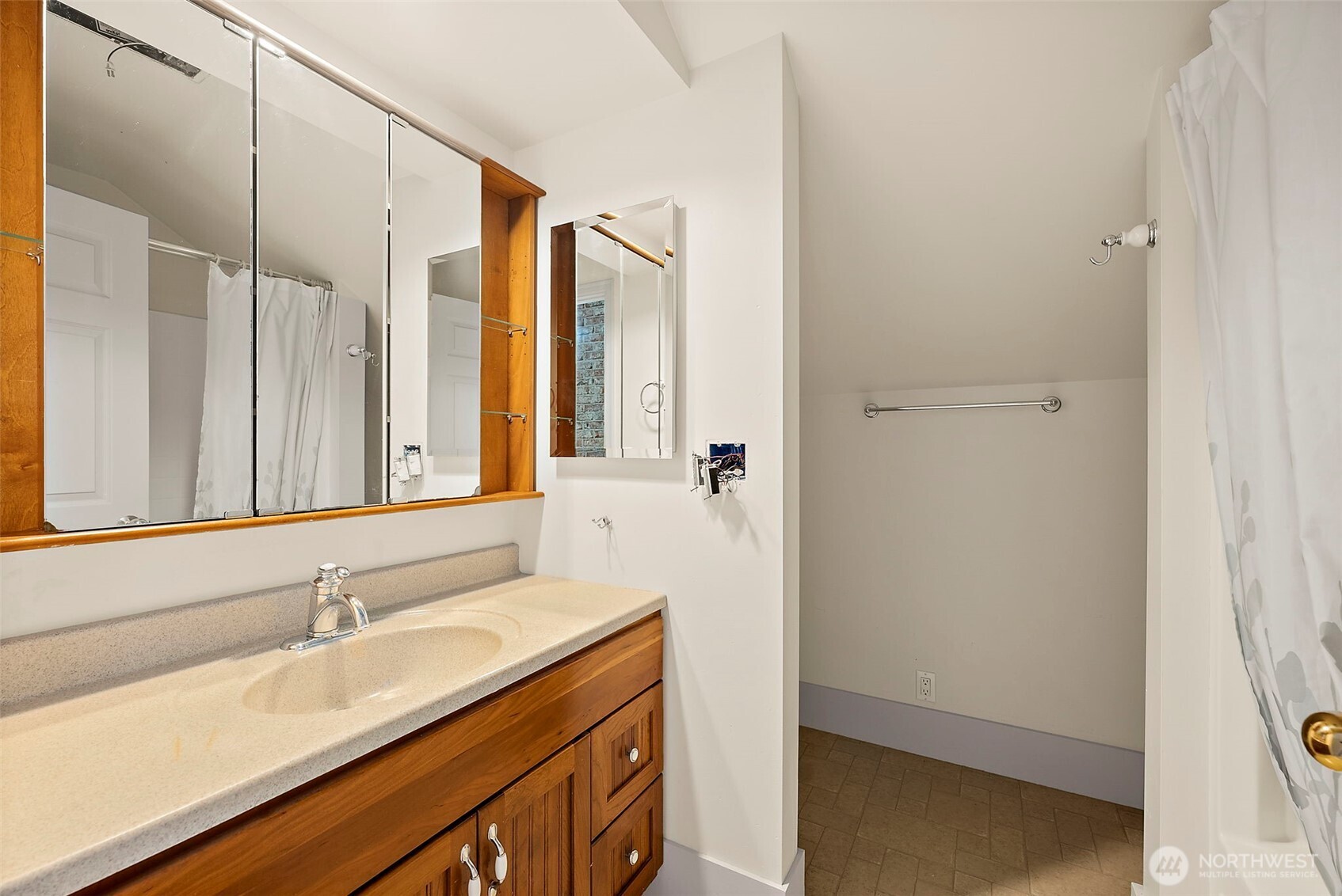 5207 North Pearl Street Ruston, WA 98407 - Photo 22 of 39 a bathroom with a sink and a mirror