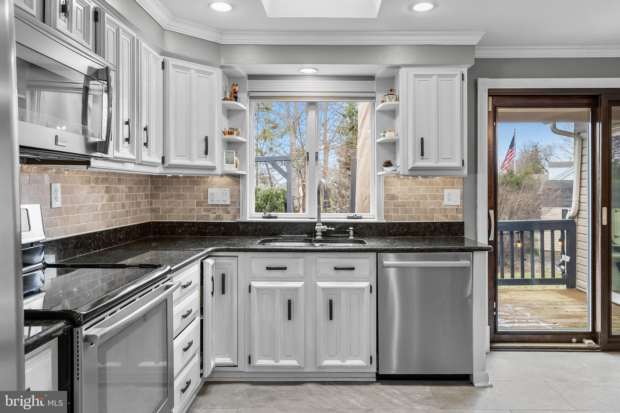 2407 Riverton Road Cinnaminson, NJ 08077 - Photo 11 of 54 a kitchen with granite countertop a sink stainless steel appliances and cabinets