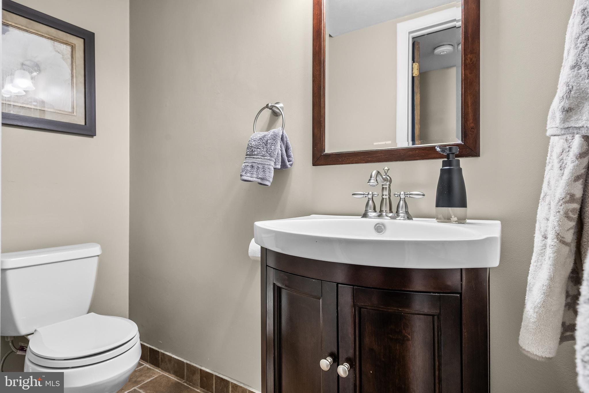 2407 Riverton Road Cinnaminson, NJ 08077 - Photo 24 of 54 a bathroom with a toilet a sink and mirror