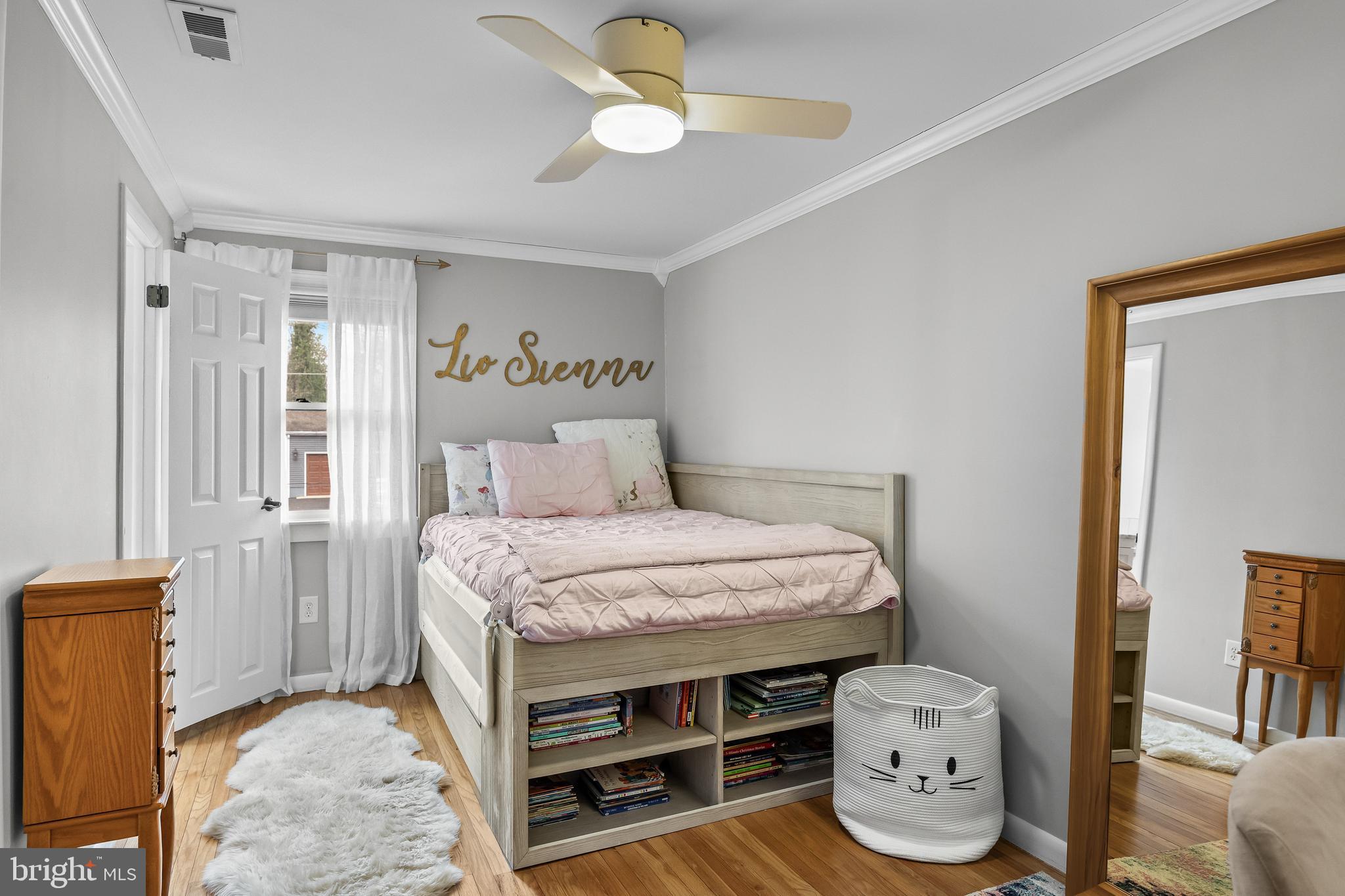 2407 Riverton Road Cinnaminson, NJ 08077 - Photo 28 of 54 a bedroom with a bed and a chandelier