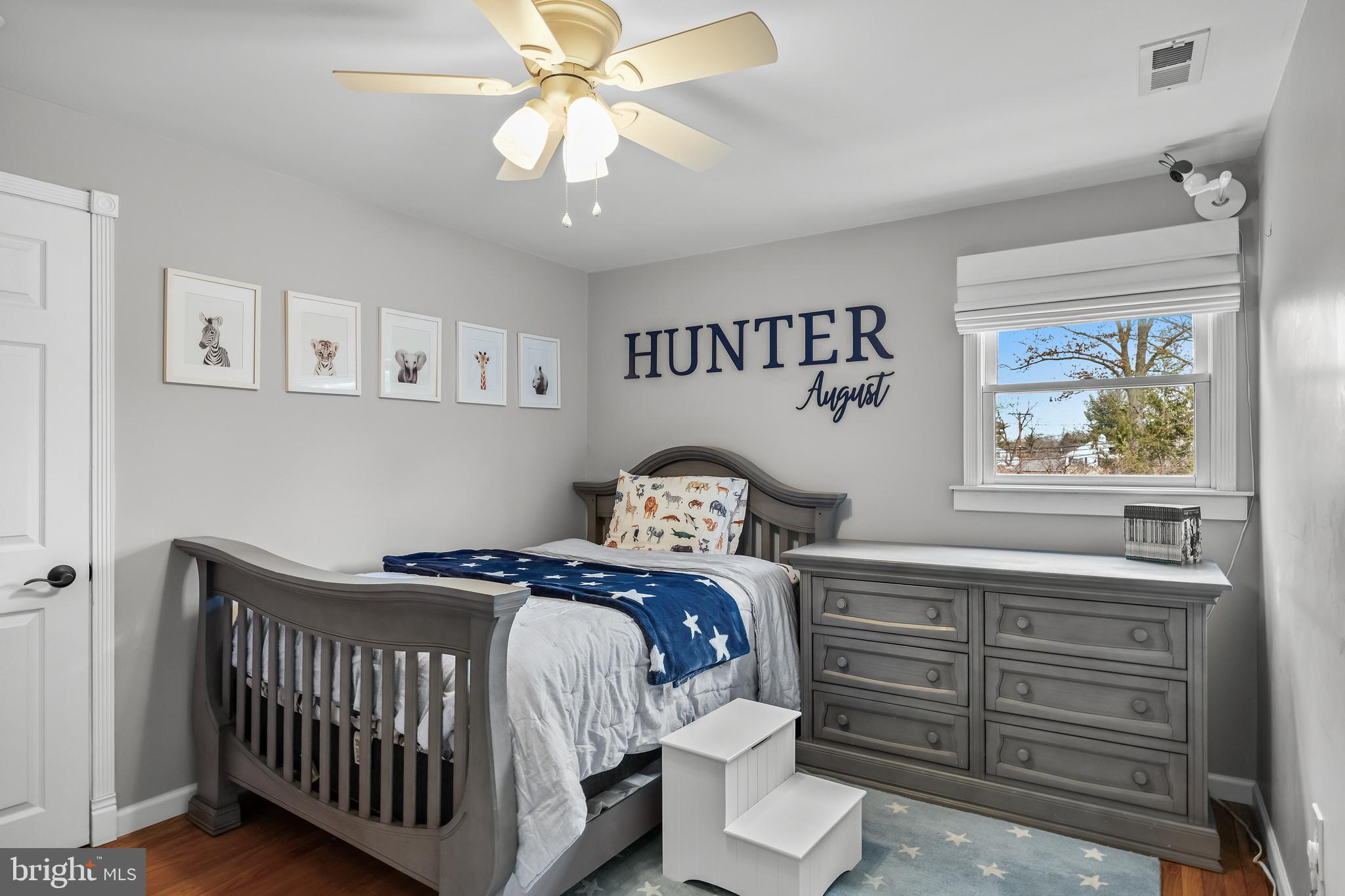2407 Riverton Road Cinnaminson, NJ 08077 - Photo 33 of 54 a bedroom with a bed and a chandelier