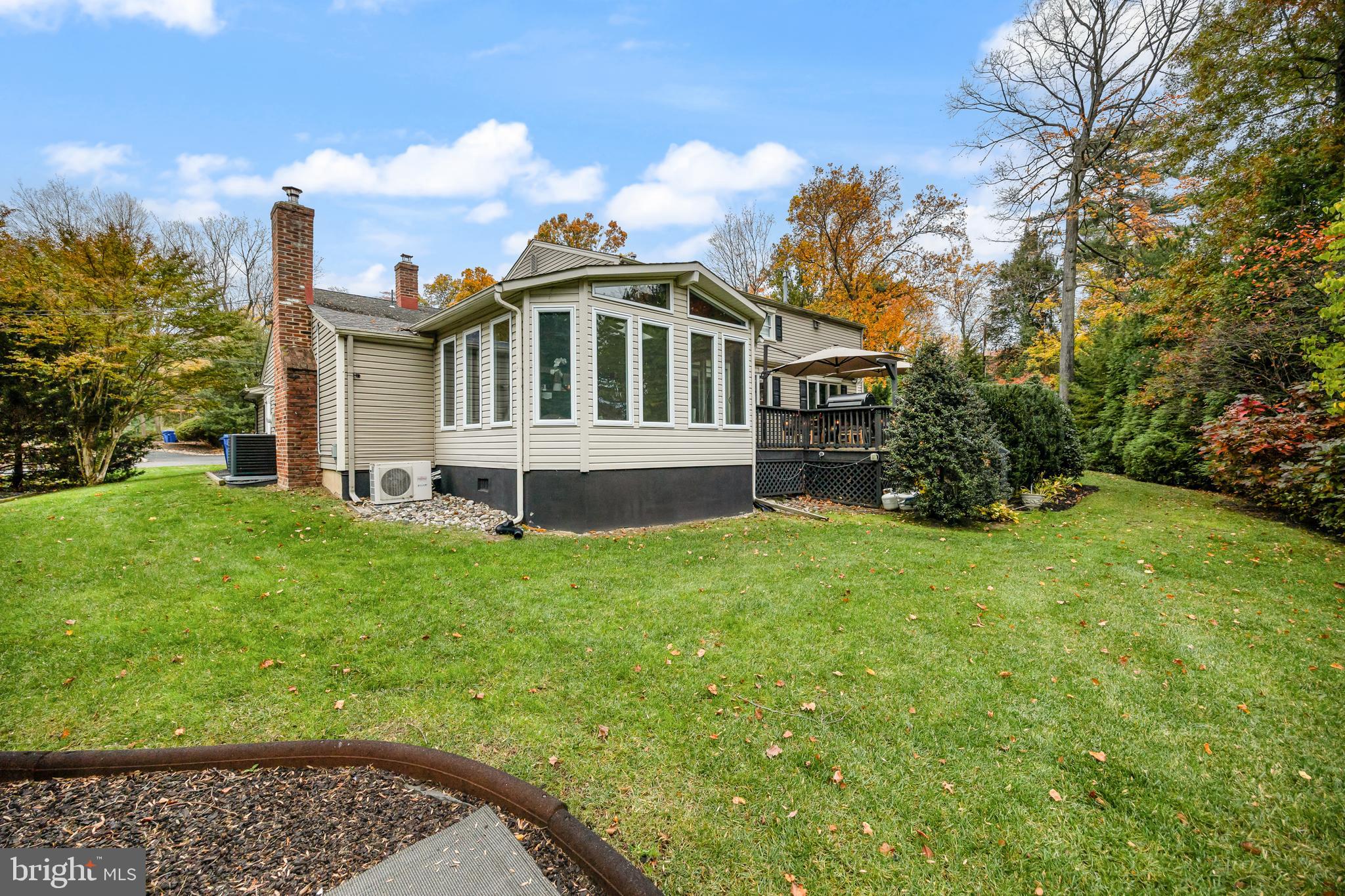 2407 Riverton Road Cinnaminson, NJ 08077 - Photo 41 of 54 a front view of a house with a garden
