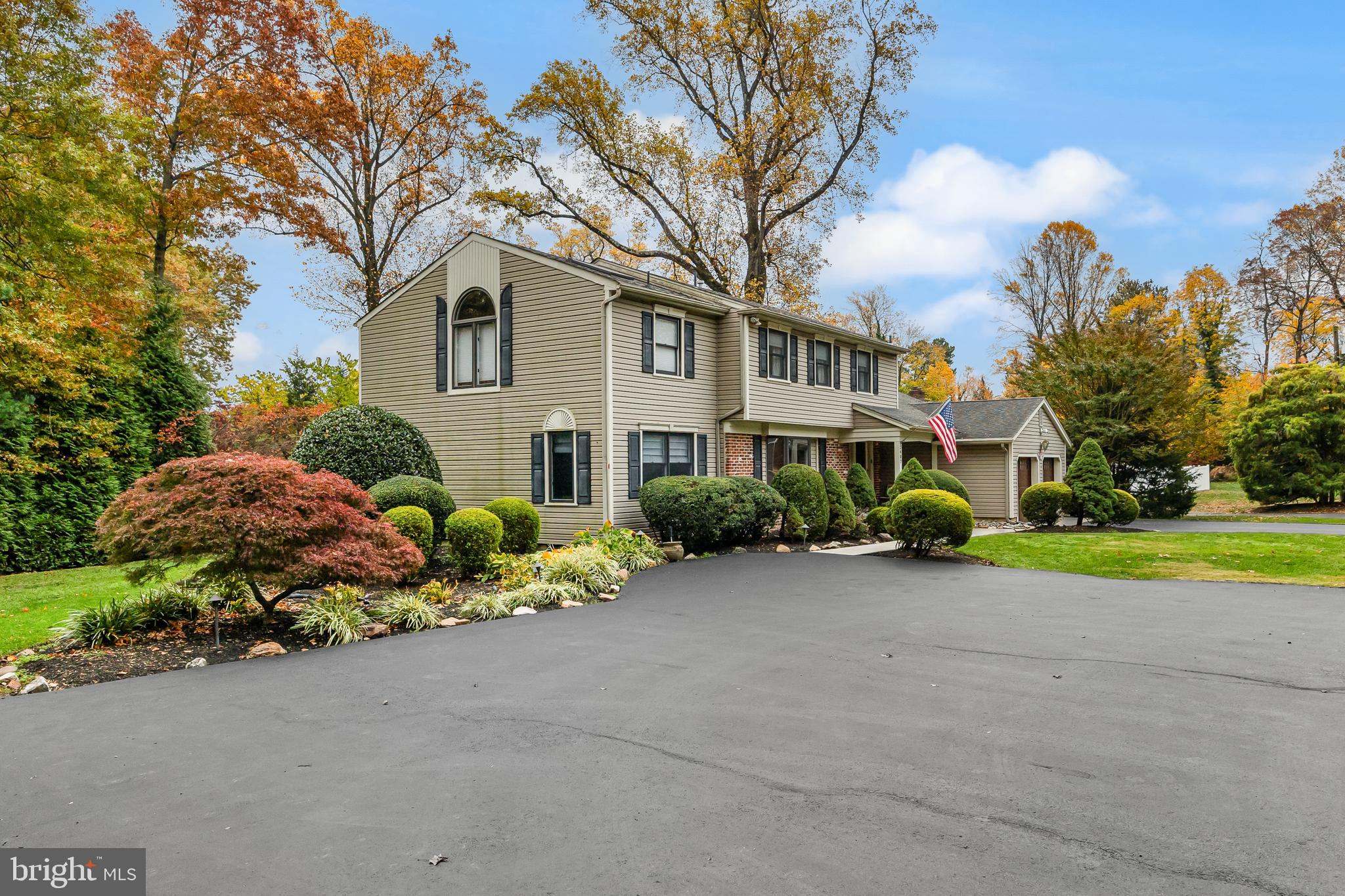 2407 Riverton Road Cinnaminson, NJ 08077 - Photo 42 of 54 a front view of a house with a yard and shrubs