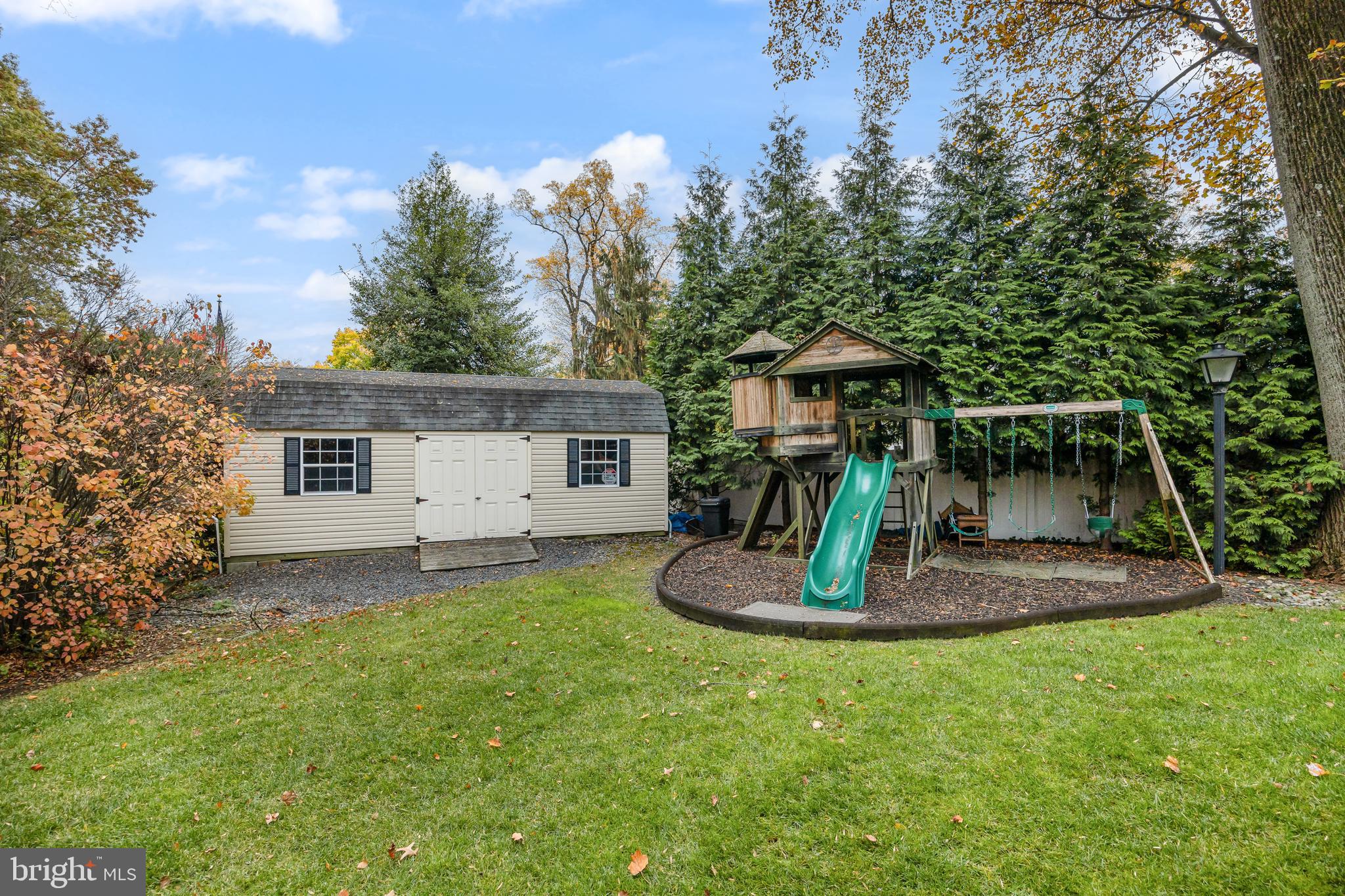 2407 Riverton Road Cinnaminson, NJ 08077 - Photo 48 of 54 a front view of a house with a yard garage and outdoor seating