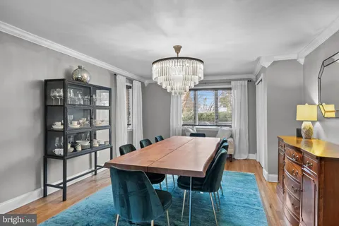 a view of a dining room with furniture and window