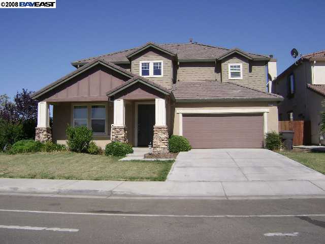 484 Presidio Place Tracy, CA 95377 - Photo 1 of 1 a front view of a house with a yard and garage