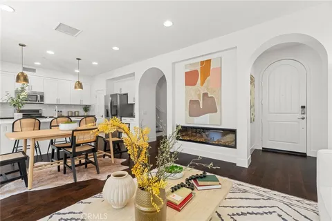 a living room with lots of furniture and painting on the wall