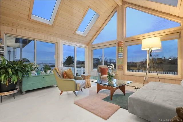 a building outdoor space with patio furniture and garden