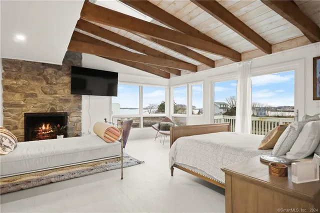 a living room with furniture fireplace and a flat screen tv