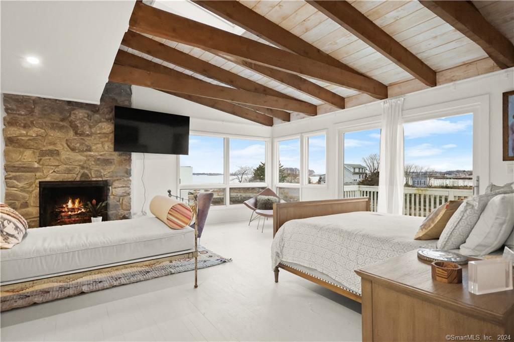 36 Spriteview Avenue Westport, CT 06880 - Photo 15 of 33 a living room with furniture fireplace and a flat screen tv