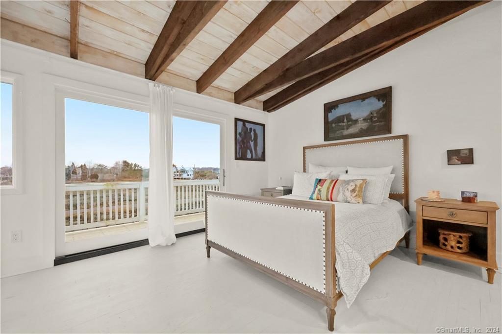 36 Spriteview Avenue Westport, CT 06880 - Photo 16 of 33 a spacious bedroom with a bed and a view of balcony
