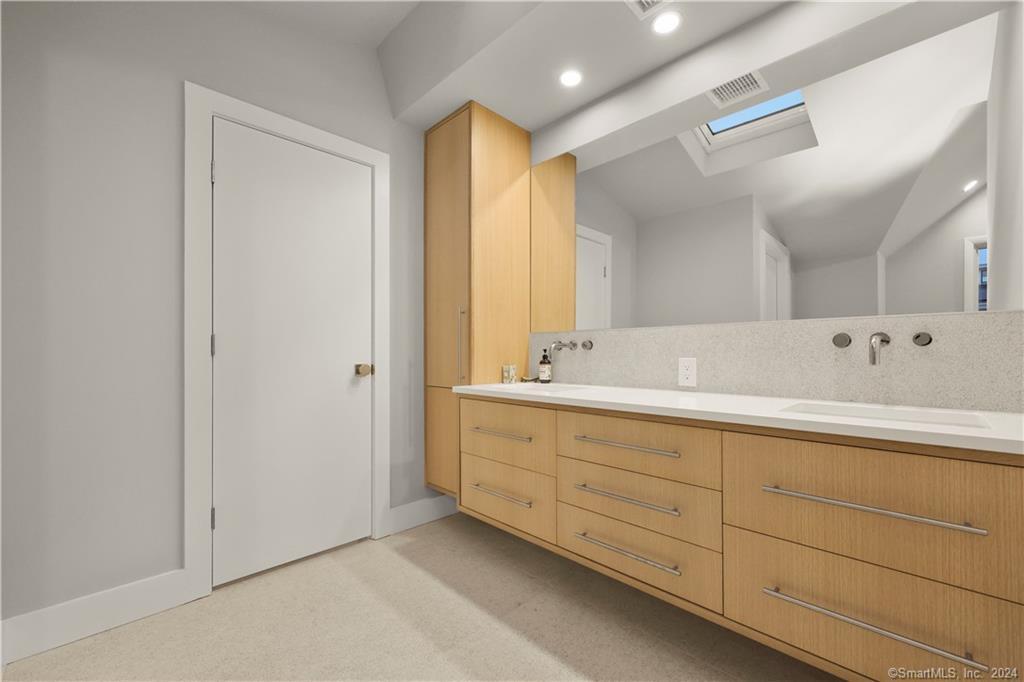 36 Spriteview Avenue Westport, CT 06880 - Photo 17 of 33 a bathroom with double sink and three mirror