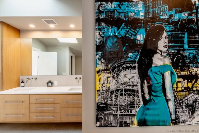 a bathroom with a sink and mirror