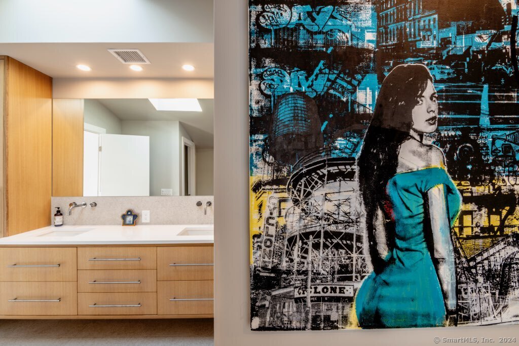 36 Spriteview Avenue Westport, CT 06880 - Photo 18 of 33 a bathroom with a sink and mirror