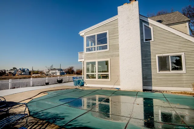 a view of a house with a lounge chairs
