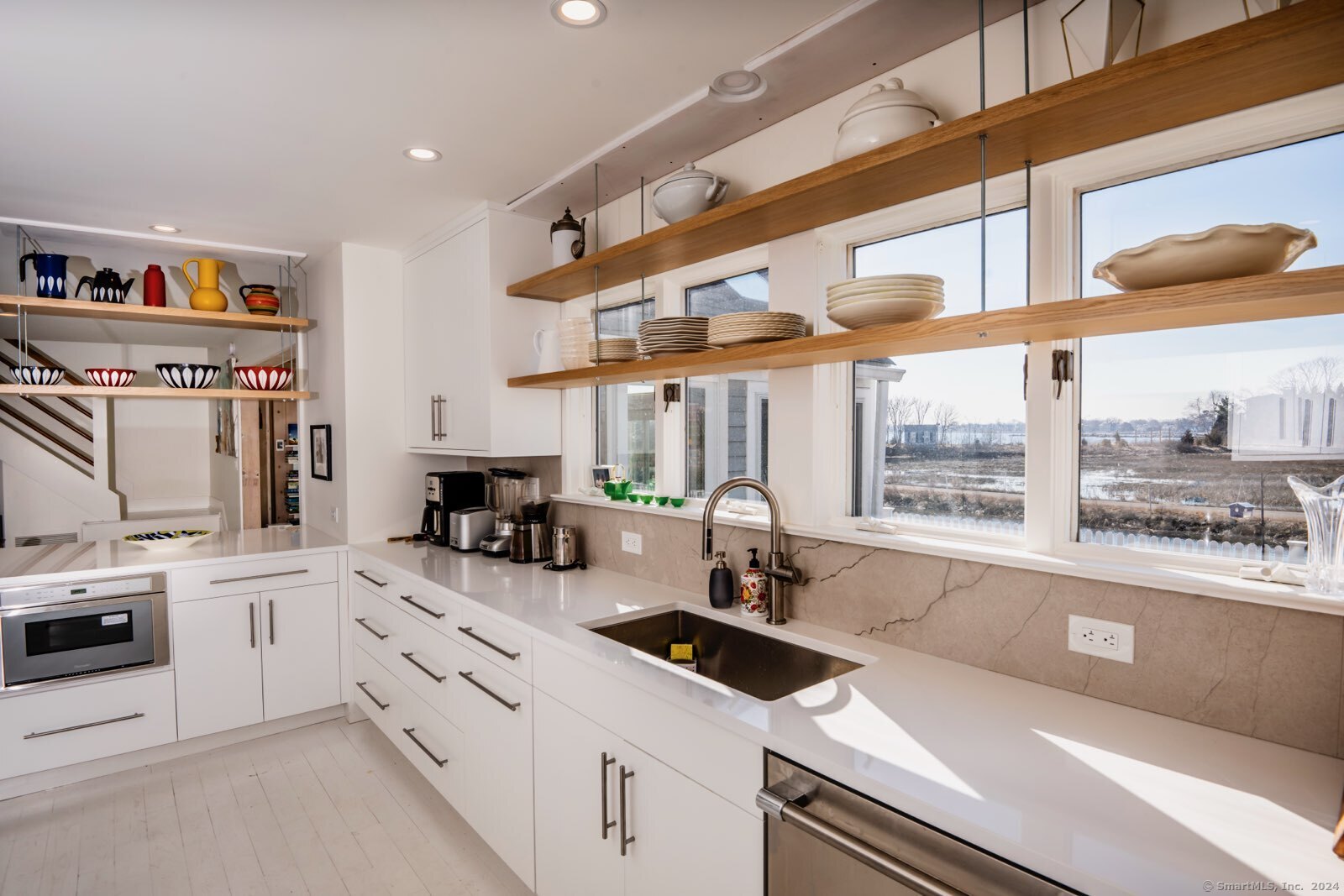 36 Spriteview Avenue Westport, CT 06880 - Photo 5 of 33 a kitchen with a sink a stove and cabinets