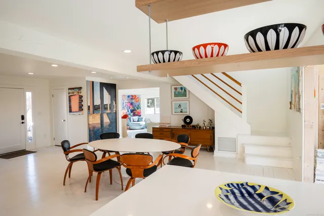 a outdoor living space with furniture and a book shelf