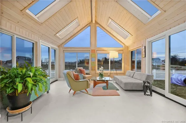 a building outdoor space with patio furniture and potted plants