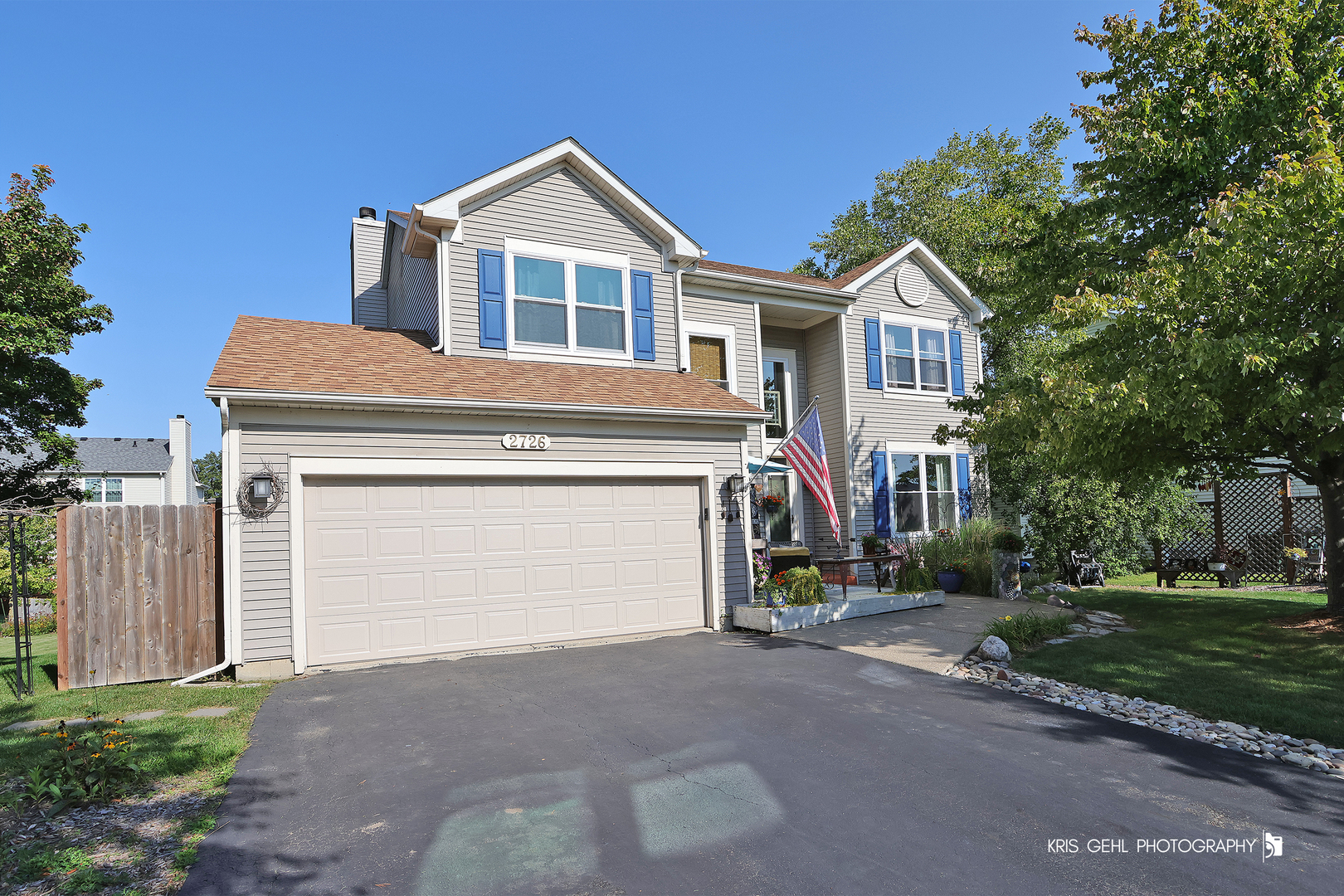 2726 Providence Lane Lindenhurst, IL 60046 - Photo 1 of 29 a front view of a house with a yard and garage