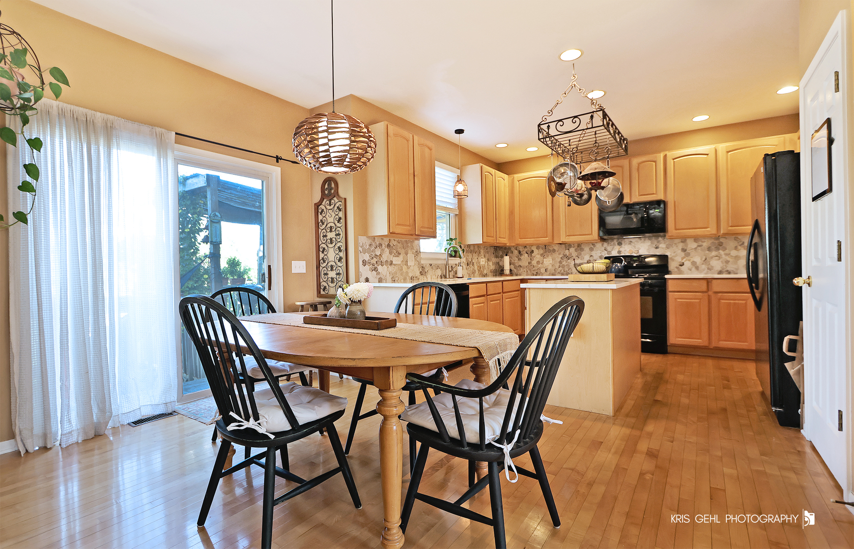2726 Providence Lane Lindenhurst, IL 60046 - Photo 9 of 29 a dining room filled chandelier and wooden floor