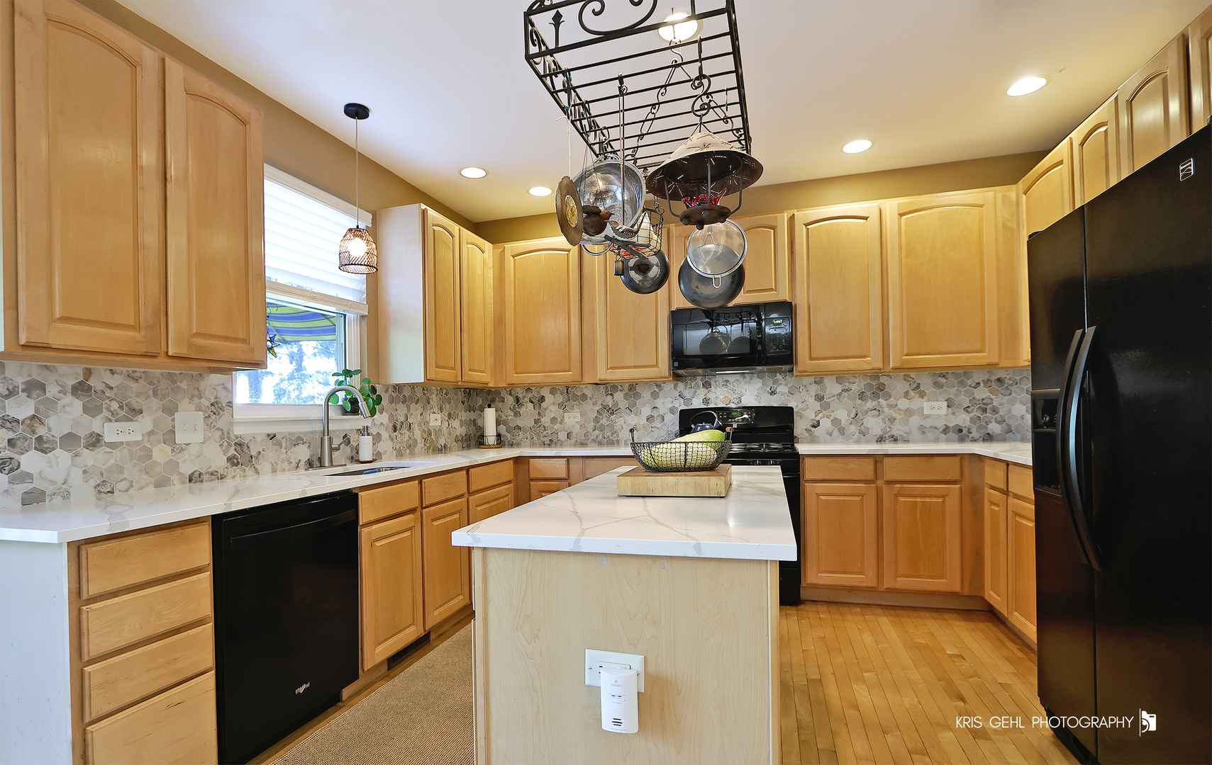 2726 Providence Lane Lindenhurst, IL 60046 - Photo 10 of 29 a kitchen with a sink a counter top space cabinets and stainless steel appliances