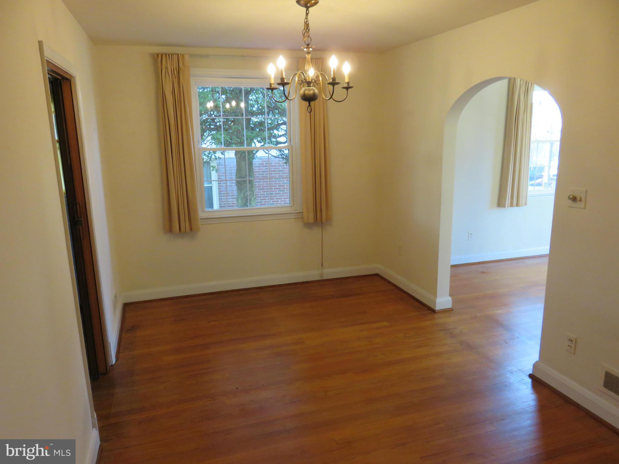 1747 Ellinwood Road Baltimore, MD 21237 - Photo 9 of 26 a view of a room with wooden floor and window