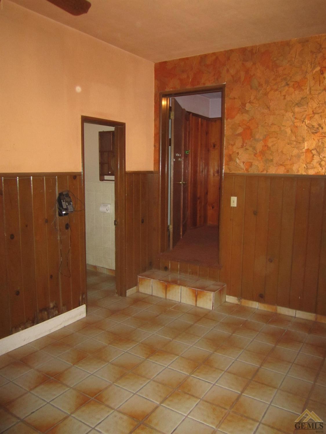 Undisclosed Address Bakersfield, CA 93305 - Photo 13 of 18 an empty room with a door