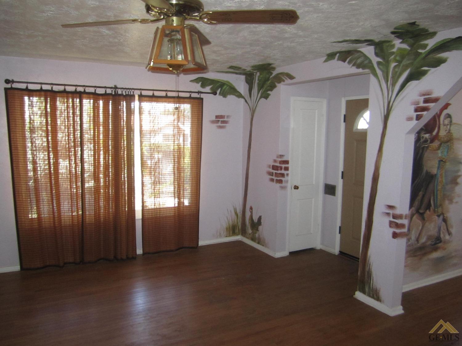 Undisclosed Address Bakersfield, CA 93305 - Photo 2 of 18 a view of entryway with window and hallway