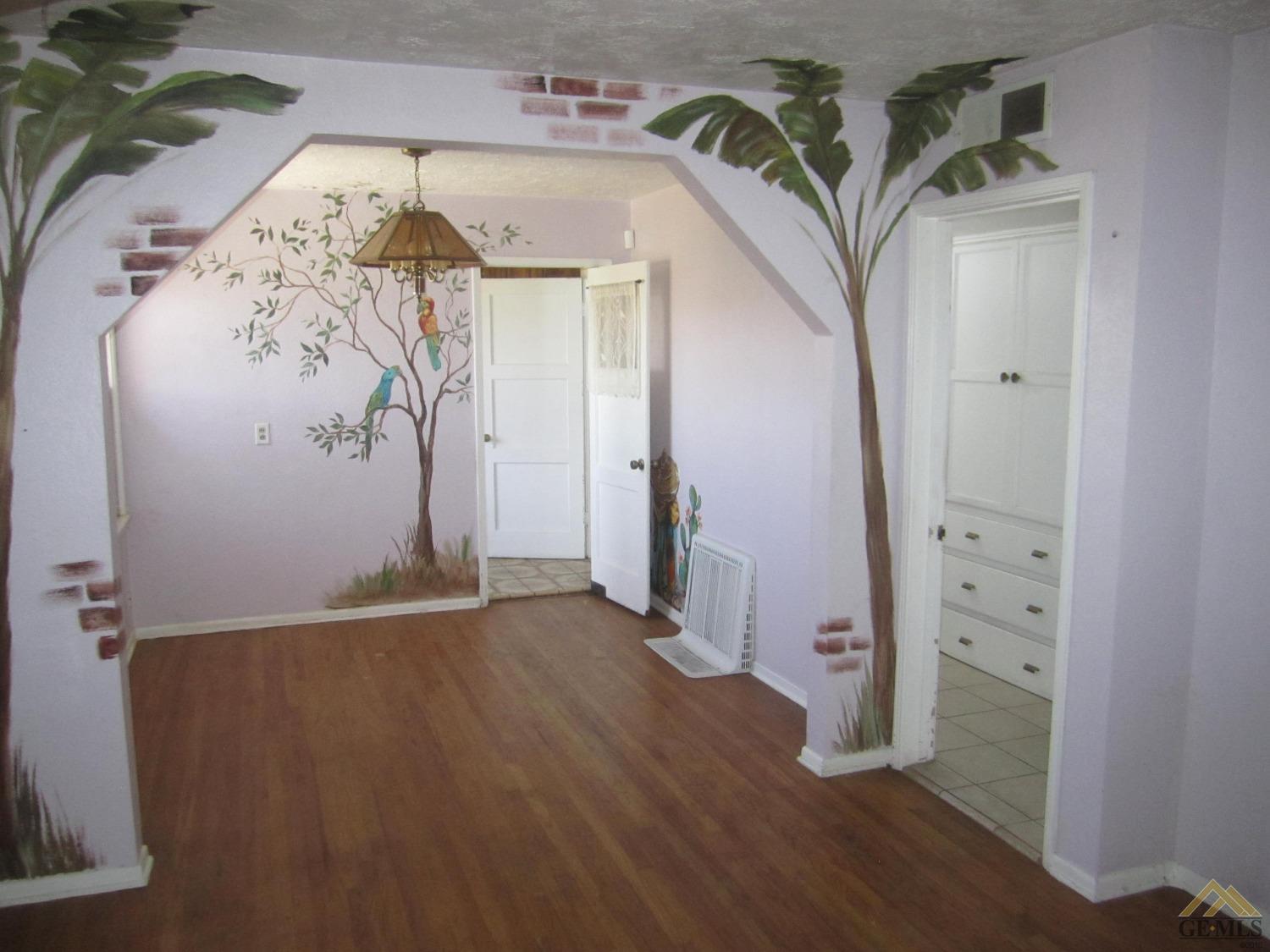 Undisclosed Address Bakersfield, CA 93305 - Photo 5 of 18 a view of a hallway with wooden floor and entryway