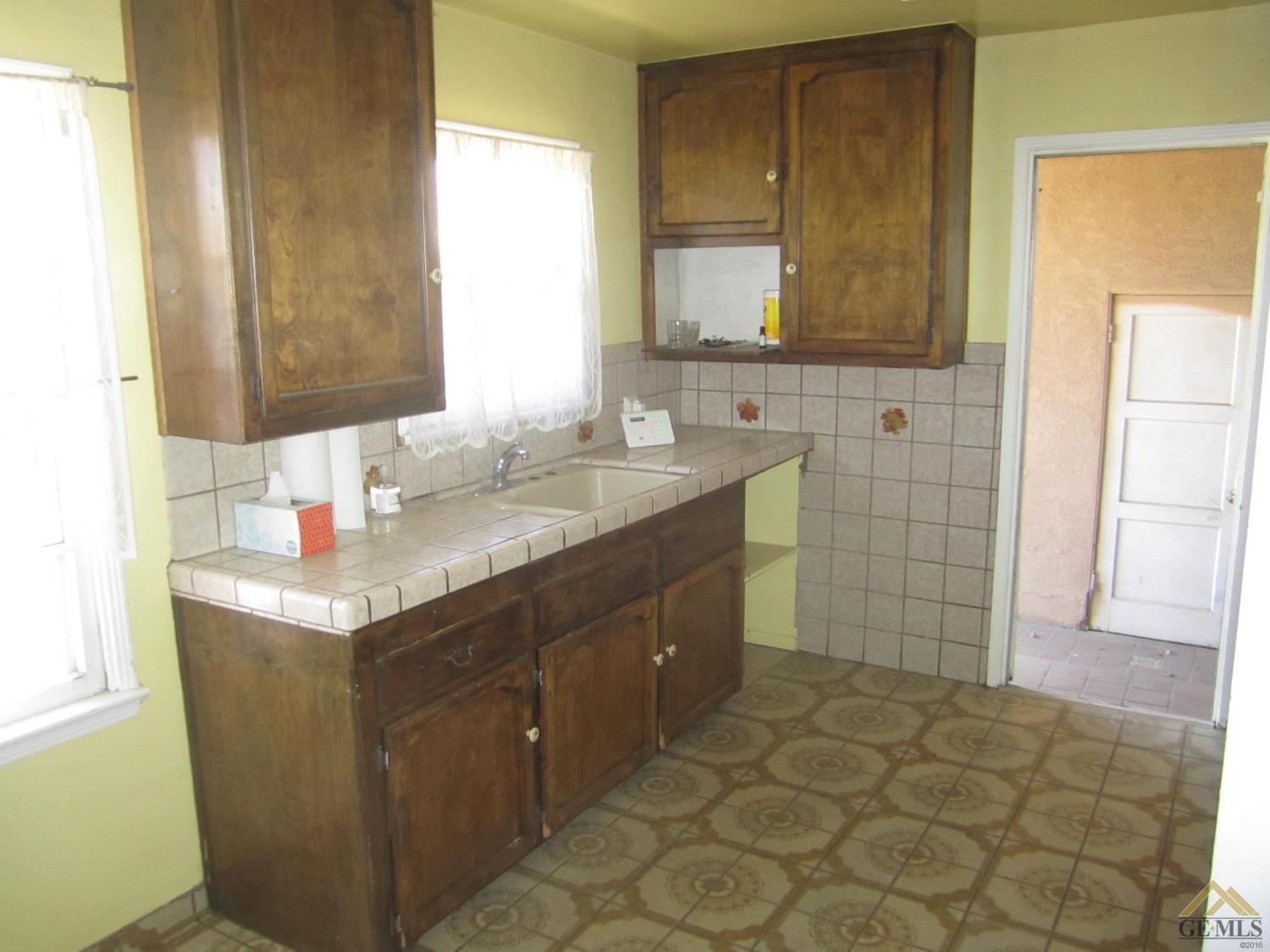 Undisclosed Address Bakersfield, CA 93305 - Photo 7 of 18 a bathroom with a sink vanity granite and a mirror