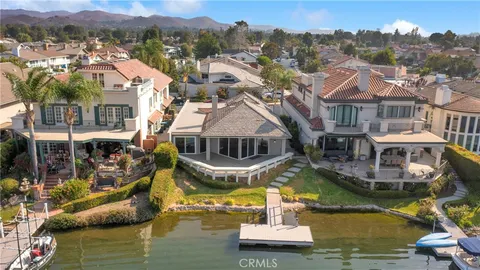 an aerial view of a house with a ocean view