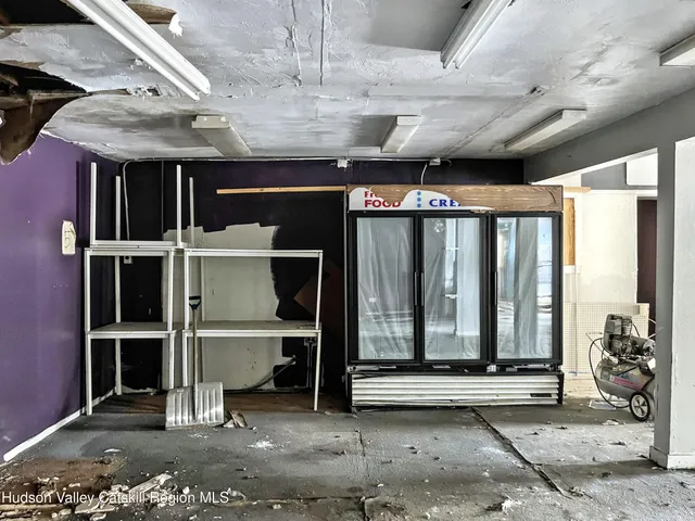 a view of livingroom with furniture and floor to ceiling windows