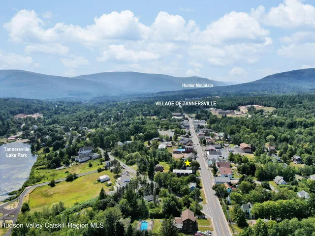 a view of a house with a yard from a balcony