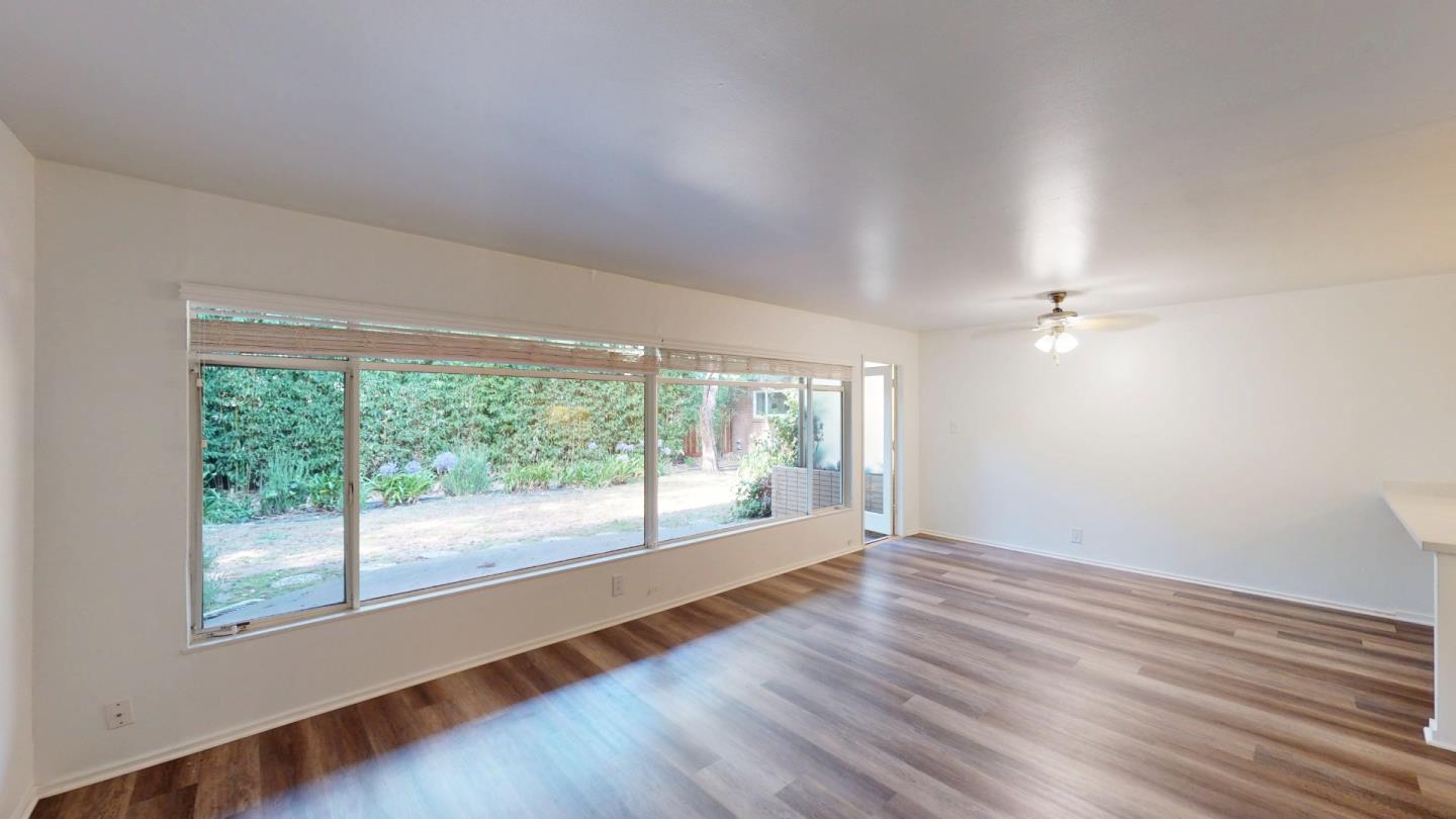1222 Irwin Street San Rafael, CA 94901 - Photo 3 of 11 a view of empty room with wooden floor and fan