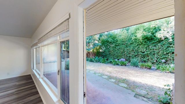 a view of a balcony with wooden floor