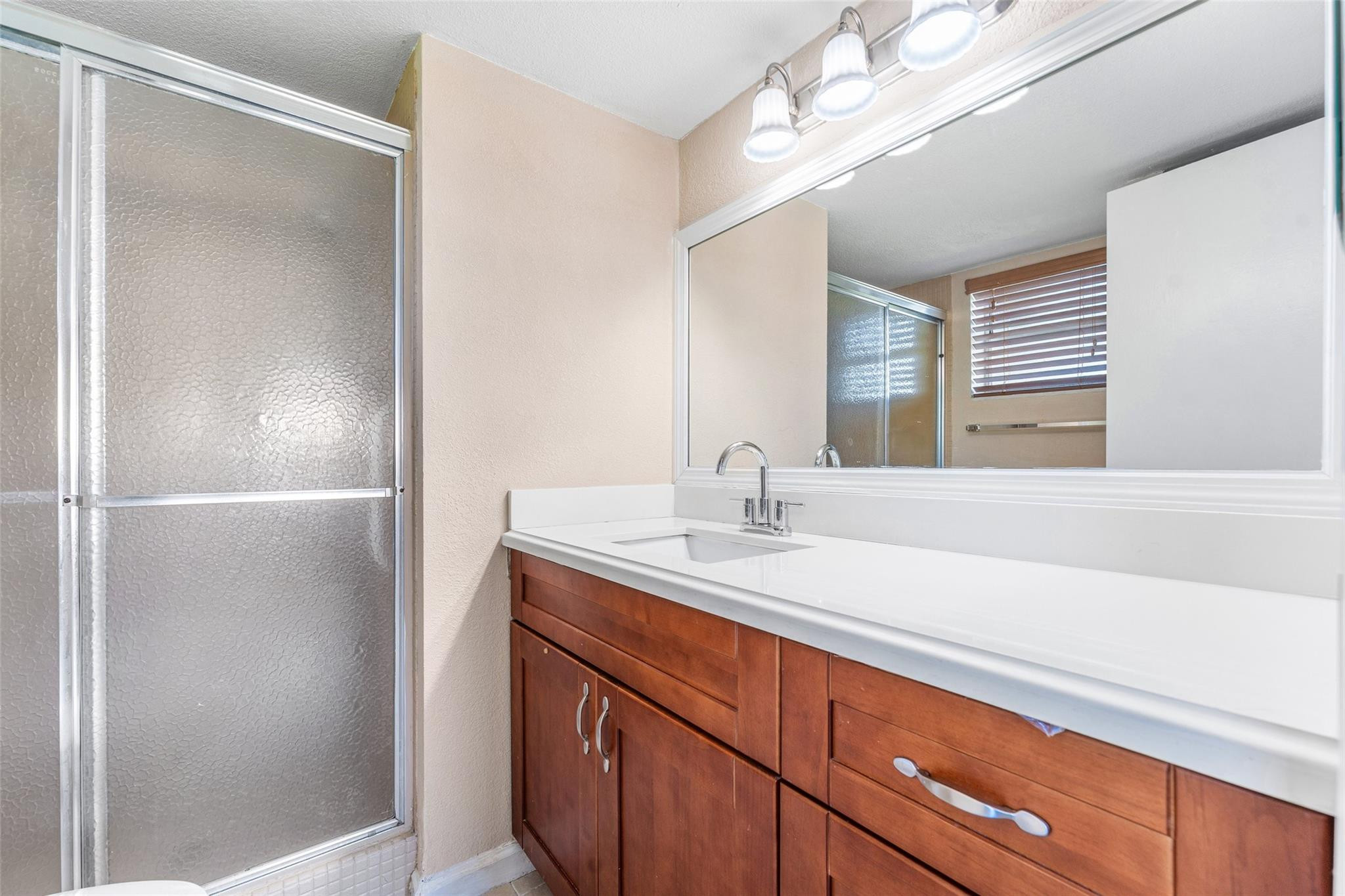 2720 North Pine Island Road, Unit 212 Sunrise, FL 33322 - Photo 11 of 46 MAIN BATHROOM UPDATED & WALK IN SHOWER