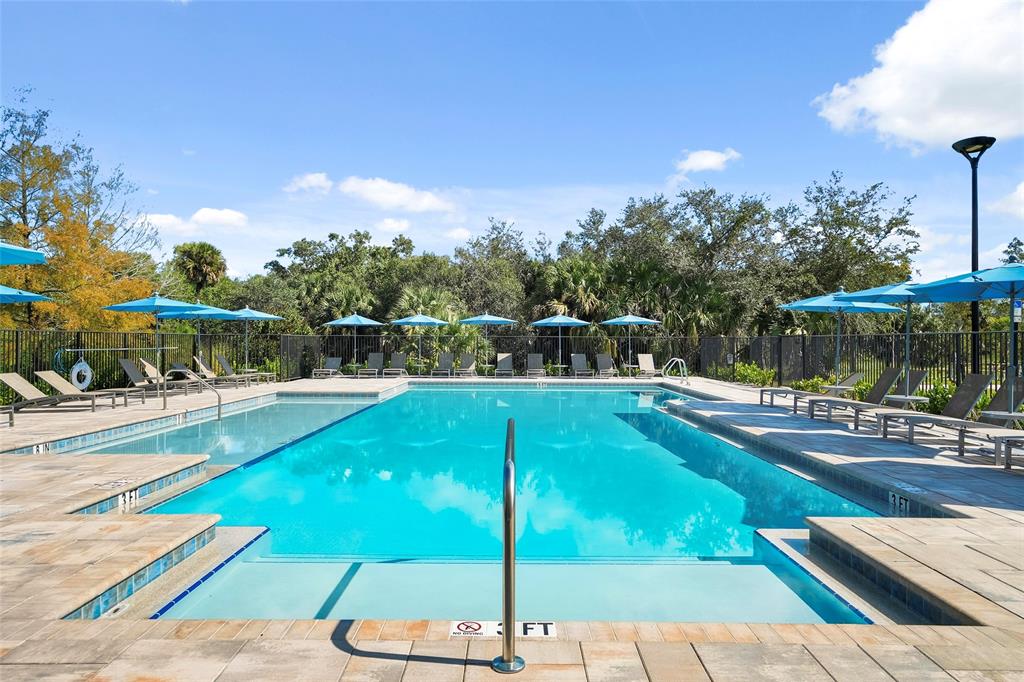 285 Southwest Sally Way Stuart, FL 34997 - Photo 1 of 48 a view of a swimming pool with a patio