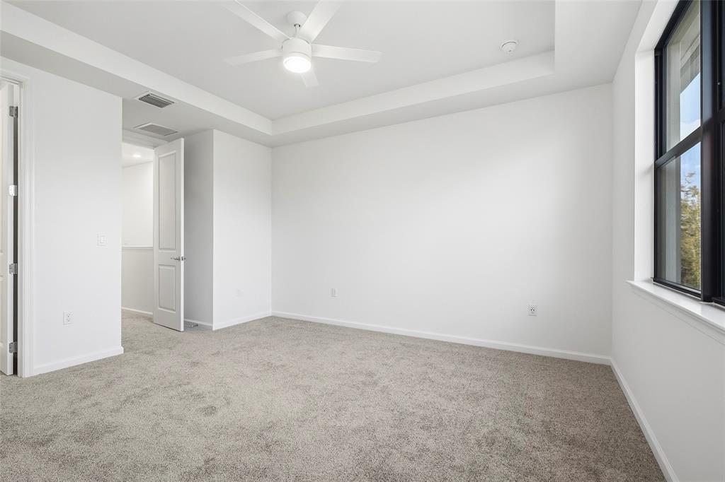 285 Southwest Sally Way Stuart, FL 34997 - Photo 12 of 48 an empty room with windows and fan