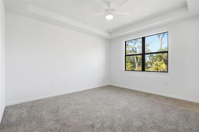 an empty room with closet and a bathroom