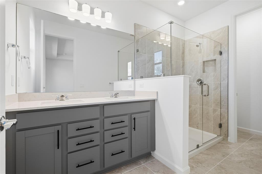 285 Southwest Sally Way Stuart, FL 34997 - Photo 15 of 48 a bathroom with a double vanity sink mirror and double