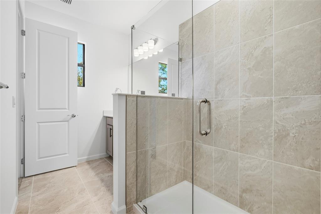 285 Southwest Sally Way Stuart, FL 34997 - Photo 16 of 48 a bathroom with a shower and a sink