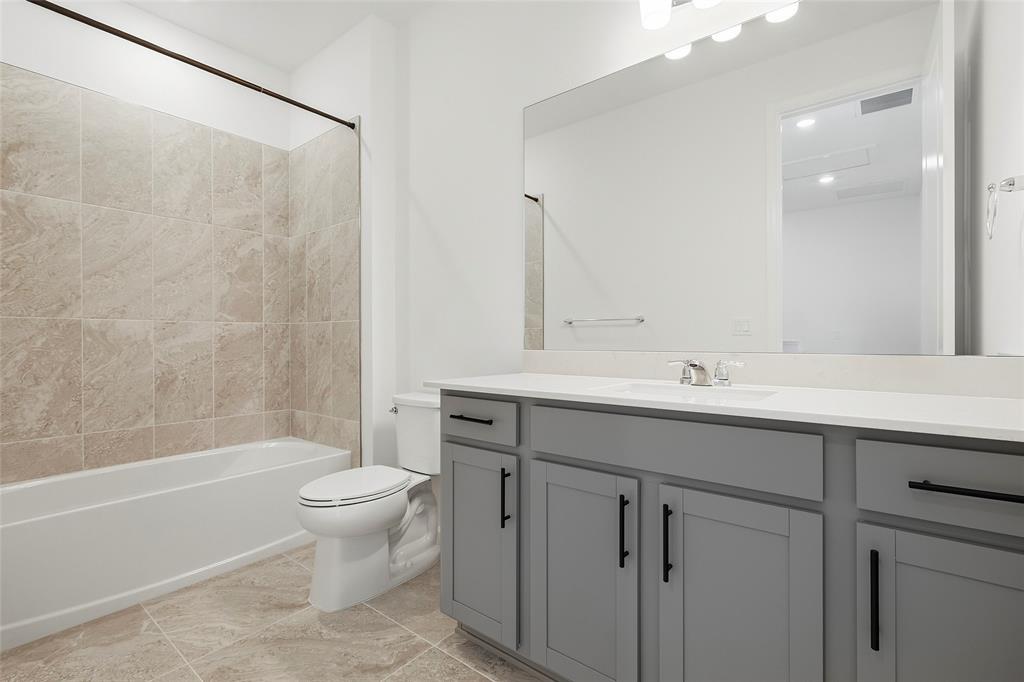 285 Southwest Sally Way Stuart, FL 34997 - Photo 20 of 48 a bathroom with a sink toilet and shower