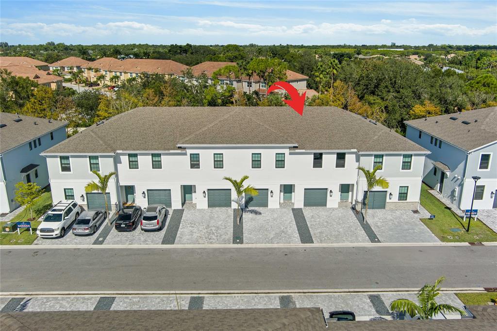 285 Southwest Sally Way Stuart, FL 34997 - Photo 34 of 48 an aerial view of multiple houses with a terrace
