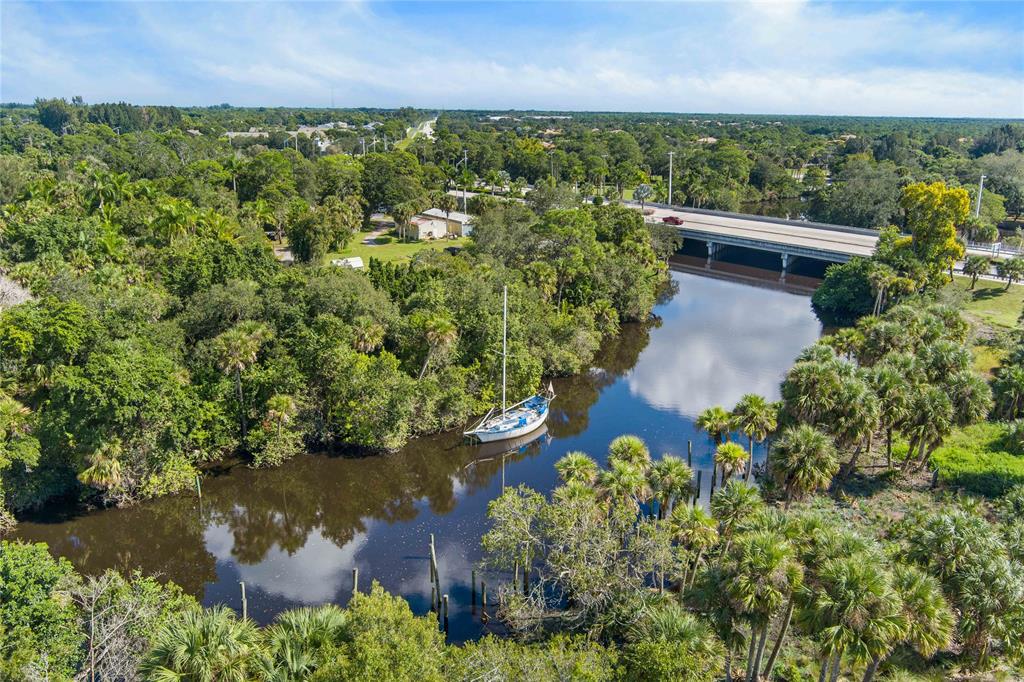 285 Southwest Sally Way Stuart, FL 34997 - Photo 38 of 48 an aerial view of a house with a yard
