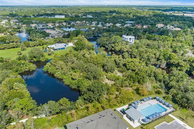 an aerial view of a house with a lake view