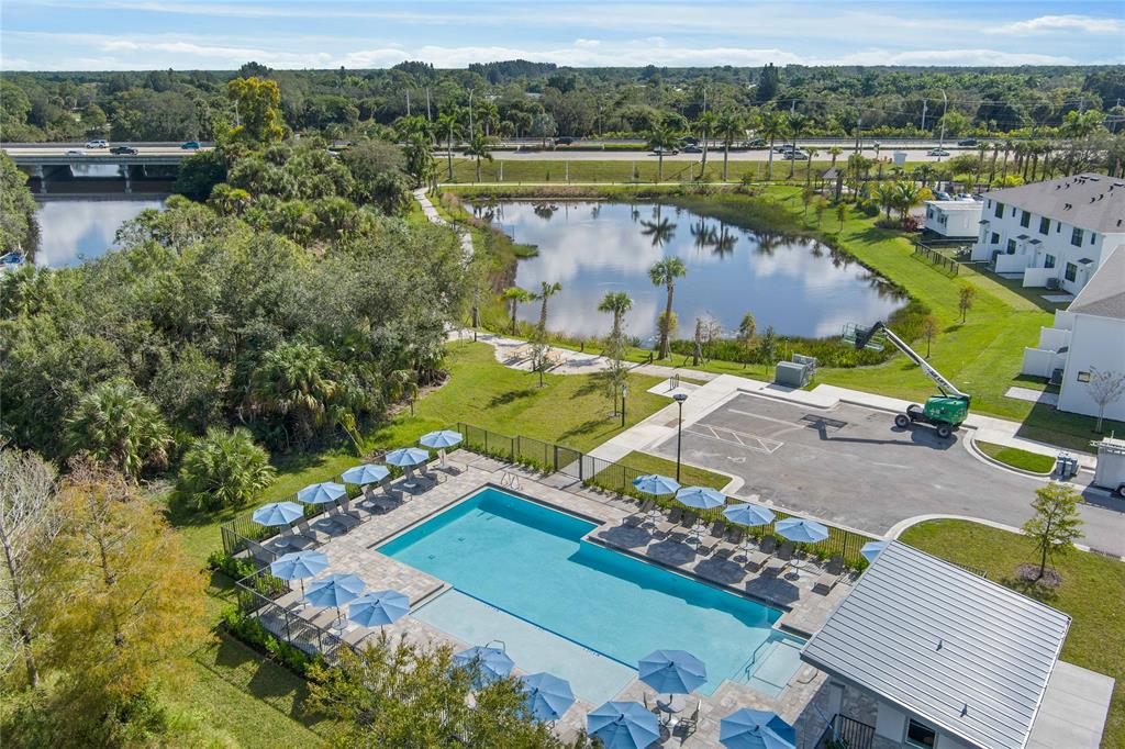 285 Southwest Sally Way Stuart, FL 34997 - Photo 40 of 48 an aerial view of a house with a lake view
